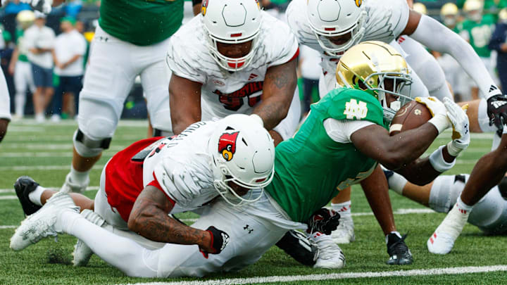 Notre Dame running back Jeremiyah Love (4) lays out to score a touchdown during a NCAA college football game between Notre Dame and Louisville at Notre Dame Stadium on Saturday, Sept. 28, 2024, in South Bend.