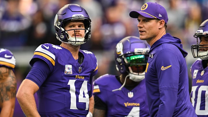 Oct 20, 2024; Minneapolis, Minnesota, USA; Minnesota Vikings quarterback Sam Darnold (14) and Minnesota Vikings head coach Kevin O'Connell and fullback C.J. Ham (right) look on before the game against the Detroit Lions at U.S. Bank Stadium. Oct 20, 2024; Minneapolis, Minnesota, USA; Minnesota Vikings quarterback Sam Darnold (14) and Minnesota Vikings head coach Kevin O'Connell and fullback C.J. Ham (right) look on before the game against the Detroit Lions at U.S. Bank Stadium.