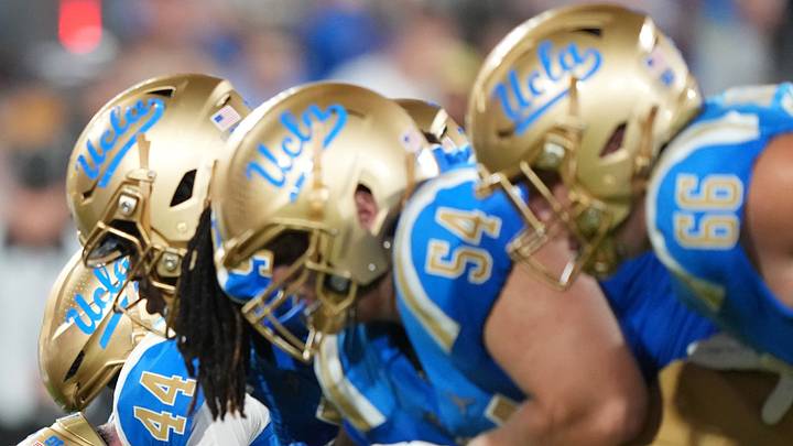 Sep 19, 2026; Pasadena, California, USA; Helmets at the line of scrimmage UCLA Bruins long snapper Giancarlo Cereghino (44) snaps the ball against the Purdue Boilermakers in the first half at the Rose Bowl. Mandatory Credit: Kirby Lee-Imagn Images Sep 19, 2026; Pasadena, California, USA; Helmets at the line of scrimmage UCLA Bruins long snapper Giancarlo Cereghino (44) snaps the ball against the Purdue Boilermakers in the first half at the Rose Bowl. Mandatory Credit: Kirby Lee-Imagn Images