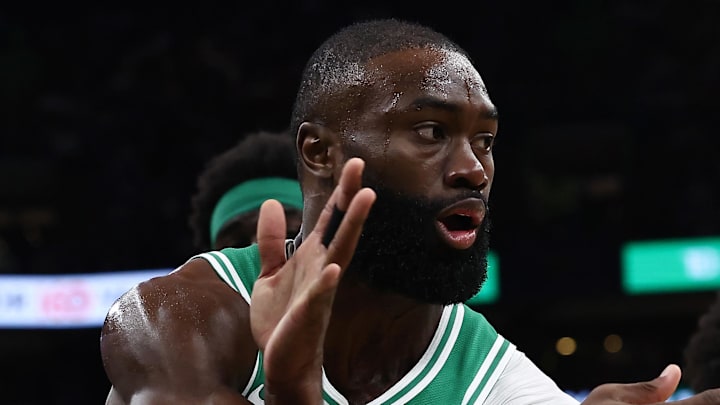 Mar 6, 2026; Boston, Massachusetts, USA; Boston Celtics guard Jaylen Brown (7) passes past Dallas Mavericks forward Naji Marshall (13) during the second quarter at TD Garden. Mandatory Credit: Winslow Townson-Imagn Images