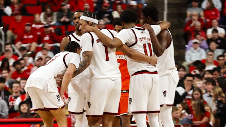 Jan 27, 2026; Raleigh, North Carolina, USA; NC State Wolfpack players huddle during the second half of the game against the Syracuse Orange at Lenovo Center. Mandatory Credit: Jaylynn Nash-Imagn Images