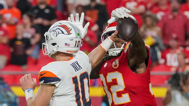 Kansas City Chiefs linebacker Nick Bolton (32) blocks pass from Denver Broncos quarterback Bo Nix at Arrowhead Stadium. Kansas City Chiefs linebacker Nick Bolton (32) blocks pass from Denver Broncos quarterback Bo Nix at Arrowhead Stadium.