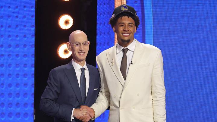 Jun 23, 2026; New York, NY, USA; NBA commissioner Adam Silver greets the eleventh pick in the 2026 NBA draft, Michigan forward Yaxel Lendeborg after he was selected by the Golden State Warriors at Barclays Center. Mandatory Credit: Brad Penner-Imagn Images