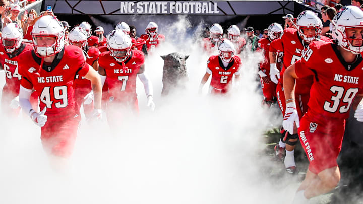 Oct 4, 2025; Raleigh, North Carolina, USA;  NC State Wolfpack run out prior to the first half of the game against Campbell Fighting Camels at Carter-Finley Stadium. Mandatory Credit: Jaylynn Nash-Imagn Images