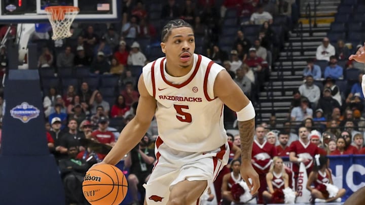 Mar 13, 2026; Nashville, TN, USA;  Arkansas Razorbacks guard Darius Acuff Jr. (5) drives to the basket against the Oklahoma Sooners during the first half at Bridgestone Arena. 