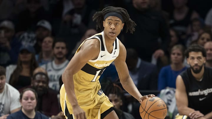 Nov 19, 2025; Minneapolis, Minnesota, USA; Washington Wizards guard Tre Johnson (12) dribbles the ball against the Minnesota Timberwolves in the second half at Target Center. Mandatory Credit: Jesse Johnson-Imagn Images