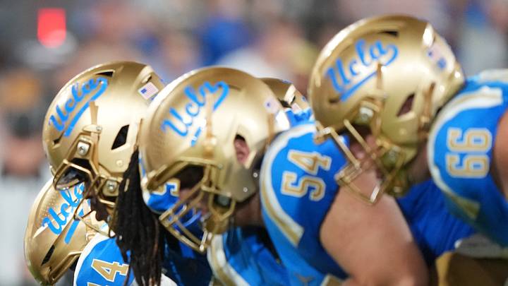 Sep 19, 2026; Pasadena, California, USA; Helmets at the line of scrimmage UCLA Bruins long snapper Giancarlo Cereghino (44) snaps the ball against the Purdue Boilermakers in the first half at the Rose Bowl. Mandatory Credit: Kirby Lee-Imagn Images Sep 19, 2026; Pasadena, California, USA; Helmets at the line of scrimmage UCLA Bruins long snapper Giancarlo Cereghino (44) snaps the ball against the Purdue Boilermakers in the first half at the Rose Bowl. Mandatory Credit: Kirby Lee-Imagn Images