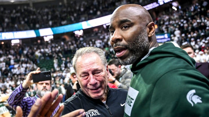 Michigan State's head coach Tom Izzo, center, hugs former player Mateen Cleaves, right, after the Spartans win over Oregon on Saturday, Feb. 8, 2025, at the Breslin Center East Lansing. Former player Mo Peterson, left, look on. Michigan State's head coach Tom Izzo, center, hugs former player Mateen Cleaves, right, after the Spartans win over Oregon on Saturday, Feb. 8, 2025, at the Breslin Center East Lansing. Former player Mo Peterson, left, look on.