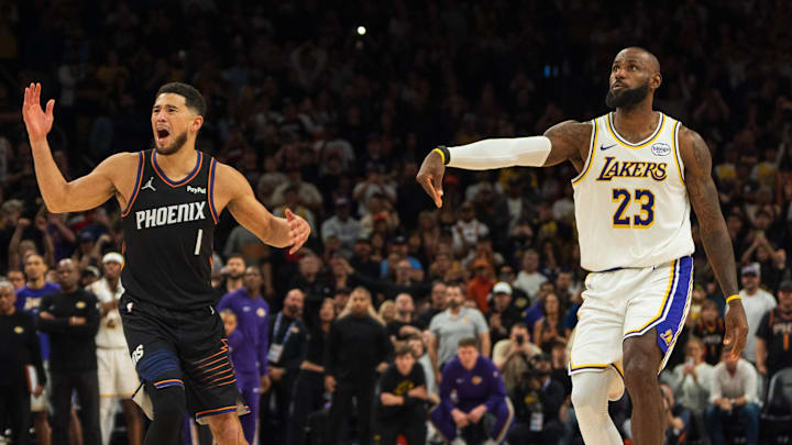 Dec 14, 2025; Phoenix, Arizona, USA; Phoenix Suns guard Devin Booker (1) reacts after being called for a foul on Los Angeles Lakers forward LeBron James (23) during the final seconds of the game at Mortgage Matchup Center. Mandatory Credit: Allan Henry-Imagn Images Dec 14, 2025; Phoenix, Arizona, USA; Phoenix Suns guard Devin Booker (1) reacts after being called for a foul on Los Angeles Lakers forward LeBron James (23) during the final seconds of the game at Mortgage Matchup Center. Mandatory Credit: Allan Henry-Imagn Images
