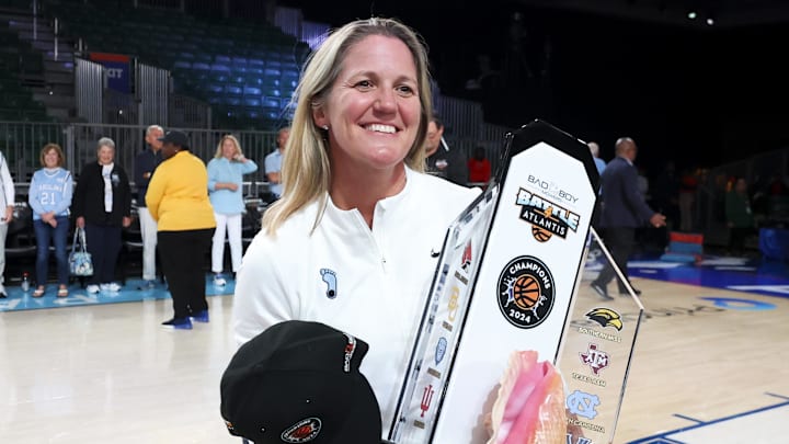 Nov 25, 2024; Paradise Island, Bahamas, BHS; North Carolina Tar Heels head coach Courtney Banghart celebrates with the Battle4Atlantis trophy after the game against the Indiana Hoosiers at the Atlantis Resort. Mandatory Credit: Kevin Jairaj-Imagn Images Nov 25, 2024; Paradise Island, Bahamas, BHS; North Carolina Tar Heels head coach Courtney Banghart celebrates with the Battle4Atlantis trophy after the game against the Indiana Hoosiers at the Atlantis Resort. Mandatory Credit: Kevin Jairaj-Imagn Images