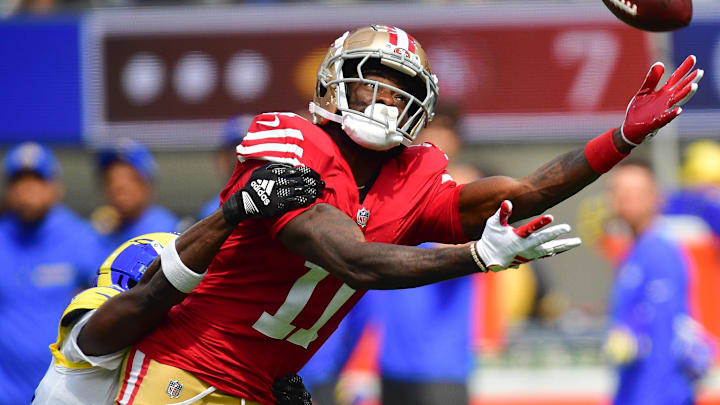Sep 22, 2024; Inglewood, California, USA; San Francisco 49ers wide receiver Brandon Aiyuk (11) misses catching a pass agianst the Los Angeles Rams during the first half at SoFi Stadium. Mandatory Credit: Gary A. Vasquez-Imagn Images Sep 22, 2024; Inglewood, California, USA; San Francisco 49ers wide receiver Brandon Aiyuk (11) misses catching a pass agianst the Los Angeles Rams during the first half at SoFi Stadium. Mandatory Credit: Gary A. Vasquez-Imagn Images