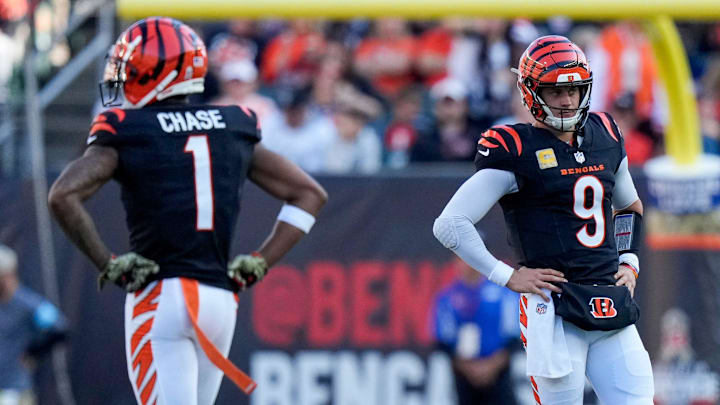 Cincinnati Bengals quarterback Joe Burrow (9) and wide receiver Ja'Marr Chase (1) paces between plays in the second quarter of the NFL Week 9 game between the Cincinnati Bengals and the Las Vegas Raiders at Paycor Stadium in downtown Cincinnati on Sunday, Nov. 3, 2024. Cincinnati Bengals quarterback Joe Burrow (9) and wide receiver Ja'Marr Chase (1) paces between plays in the second quarter of the NFL Week 9 game between the Cincinnati Bengals and the Las Vegas Raiders at Paycor Stadium in downtown Cincinnati on Sunday, Nov. 3, 2024.