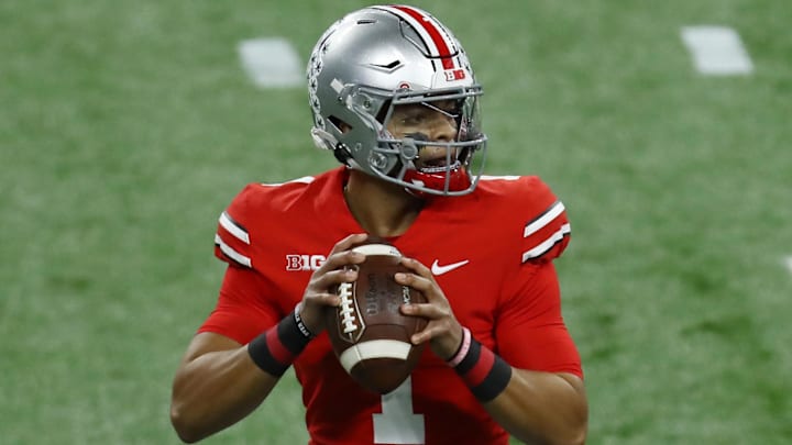 Dec 19, 2020; Indianapolis, Indiana, USA; Ohio State Buckeyes quarterback Justin Fields (1) drops back to pass against the Northwestern Wildcats during the first half at Lucas Oil Stadium. Mandatory Credit: Aaron Doster-Imagn Images