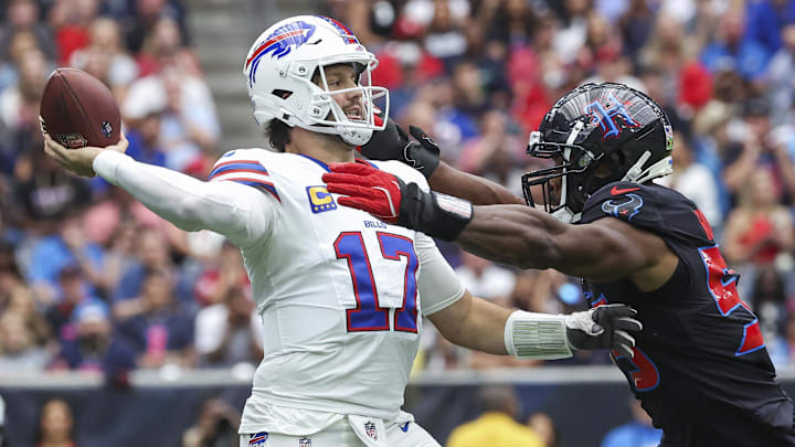 Buffalo Bills quarterback Josh Allen (17) attempts a pass as Houston Texans defensive end Danielle Hunter (55) applies defensive pressure during the first quarter at NRG Stadium. 