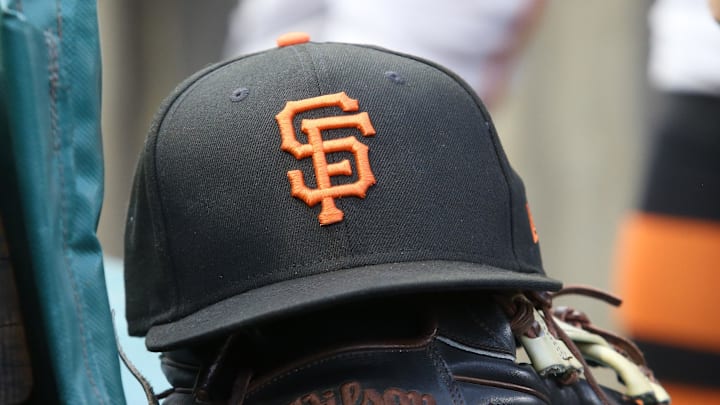 Jul 14, 2023; Pittsburgh, Pennsylvania, USA; San Francisco Giants hat and glove on the bench against the Pittsburgh Pirates during the first inning at PNC Park. Mandatory Credit: Charles LeClaire-Imagn Images Jul 14, 2023; Pittsburgh, Pennsylvania, USA; San Francisco Giants hat and glove on the bench against the Pittsburgh Pirates during the first inning at PNC Park. Mandatory Credit: Charles LeClaire-Imagn Images