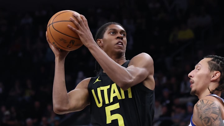 Oct 25, 2024; Salt Lake City, Utah, USA; Utah Jazz forward Cody Williams (5) goes to the basket against Golden State Warriors forward Lindy Waters III (43) during the fourth quarter at Delta Center. Mandatory Credit: Rob Gray-Imagn Images