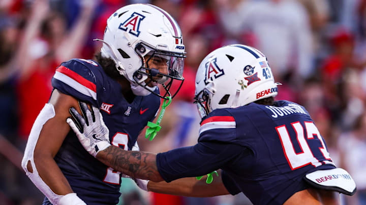 Nov 8, 2025; Tucson, Arizona, USA; Arizona Wildcats defensive backs Treydan Stukes and Dalton Johnson celebrate a win against the Kansas Jayhawks at the end of the game at Arizona Stadium. Mandatory Credit: Aryanna Frank-Imagn Images Nov 8, 2025; Tucson, Arizona, USA; Arizona Wildcats defensive backs Treydan Stukes and Dalton Johnson celebrate a win against the Kansas Jayhawks at the end of the game at Arizona Stadium. Mandatory Credit: Aryanna Frank-Imagn Images
