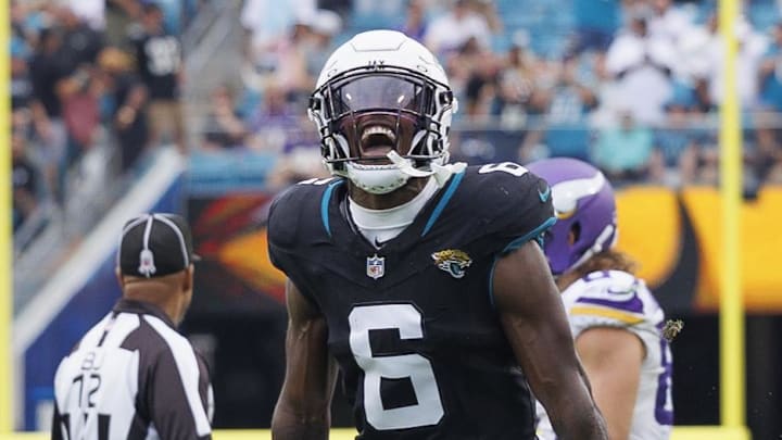 Nov 10, 2024; Jacksonville, Florida, USA; Jacksonville Jaguars safety Darnell Savage (6) celebrates an interception with safety Antonio Johnson (26) against the Minnesota Vikings during the third quarter at EverBank Stadium. Mandatory Credit: Morgan Tencza-Imagn Images