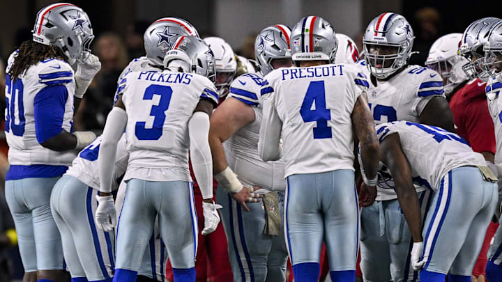 Dallas Cowboys quarterback Dak Prescott huddles with the offense during the game against the Arizona Cardinals. Dallas Cowboys quarterback Dak Prescott huddles with the offense during the game against the Arizona Cardinals.