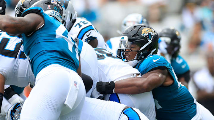 Jacksonville Jaguars defensive end Travon Walker (44) tackles Carolina Panthers running back Chuba Hubbard (30) during the second quarter of an NFL football matchup at EverBank Stadium, Sunday, Sept. 7, 2025 in Jacksonville, Fla. [Corey Perrine/Florida Times-Union]