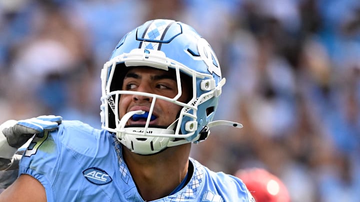 Sep 13, 2025; Chapel Hill, North Carolina, USA; North Carolina Tar Heels defensive lineman Melkart Abou-Jaoude (9 ) celebrates with defensive lineman Smith Vilbert (8) after making a sack in the first quarter at Kenan Stadium. Mandatory Credit: Bob Donnan-Imagn Images
