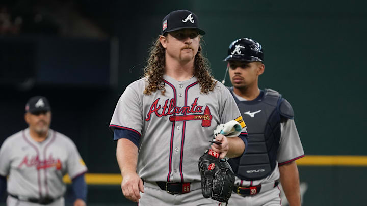 Jul 26, 2025; Arlington, Texas, USA; Atlanta Braves starting pitcher Grant Holmes (66) walks in from the bullpen prior to a game against the Texas Rangers at Globe Life Field. Mandatory Credit: Raymond Carlin III-Imagn Images