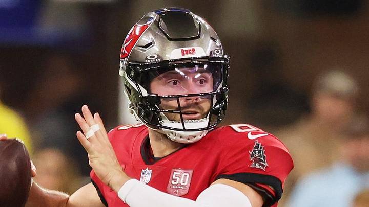Nov 23, 2025; Inglewood, California, USA; Tampa Bay Buccaneers quarterback Baker Mayfield (6) looks to pass the ball while running outside the pocket against the Los Angeles Rams during the first quarter at SoFi Stadium. Mandatory Credit: Kiyoshi Mio-Imagn Images