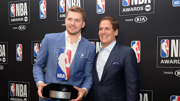 June 24, 2019; Los Angeles, CA, USA; Dallas Mavericks guard Luka Doncic poses with owner Mark Cuban following his award for Rookie Of The Year at the 2019 NBA Awards show at Barker Hanger. Mandatory Credit: Gary A. Vasquez-Imagn Images