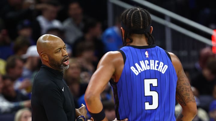Dec 20, 2023; Orlando, Florida, USA; Orlando Magic head coach Jamahl Mosley talks with forward Paolo Banchero (5) in the first half against the Miami Heat at KIA Center. Mandatory Credit: Kim Klement Neitzel-Imagn Images