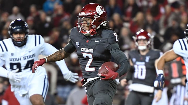 Nov 9, 2024; Pullman, Washington, USA; Washington State Cougars wide receiver Kyle Williams (2) runs the ball against the Utah State Aggies in the first half at Gesa Field at Martin Stadium. Mandatory Credit: James Snook-Imagn Images
