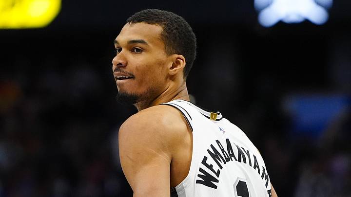 Apr 4, 2026; Denver, Colorado, USA; San Antonio Spurs forward Victor Wembanyama (1) reacts back to the Denver Nuggets bench in the first quarter at Ball Arena. Mandatory Credit: Ron Chenoy-Imagn Images