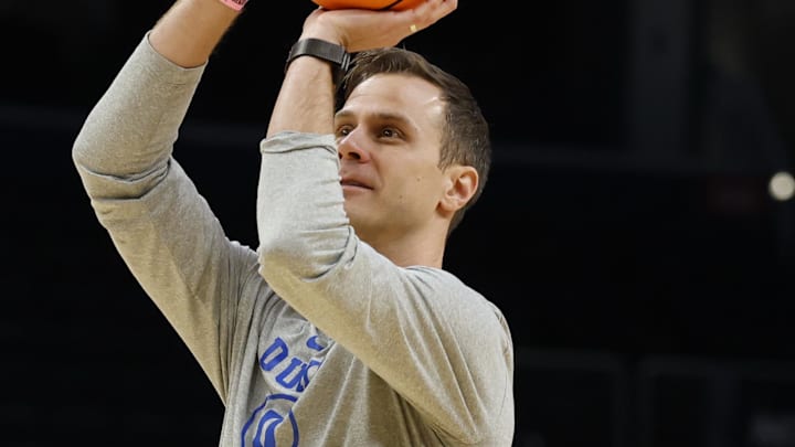 Mar 26, 2026; Washington, DC, USA; Duke Blue Devils head coach Jon Scheyer shoots a ball during a practice session ahead of the east regional of the men's 2026 NCAA Tournament at Capital One Arena. Mandatory Credit: Geoff Burke-Imagn Images