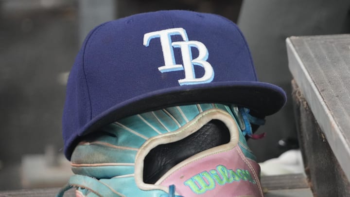 Sep 26, 2025; Toronto, Ontario, CAN; The hat and glove of Tampa Bay Rays third baseman Junior Caminero (13) in the dugout during the game against the Toronto Blue Jays at Rogers Centre. 