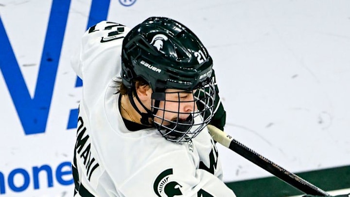 Michigan State's Anthony Romani, left, hits the puck as Minnesota's Mason Moe closes in during the first period on Friday, Jan. 23, 2026, at Munn Ice Arena in East Lansing. Michigan State's Anthony Romani, left, hits the puck as Minnesota's Mason Moe closes in during the first period on Friday, Jan. 23, 2026, at Munn Ice Arena in East Lansing.