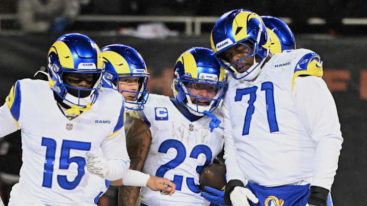 Jan 18, 2026; Chicago, IL, USA; Los Angeles Rams running back Kyren Williams (23) celebrates with wide receiver Konata Mumpfield (15), quarterback Matthew Stafford (9) and offensive tackle Warren McClendon Jr. (71) after scoring a touchdown against the Chicago Bears during the fourth quarter of an NFC Divisional Round game at Soldier Field. Mandatory Credit: Matt Marton-Imagn Images