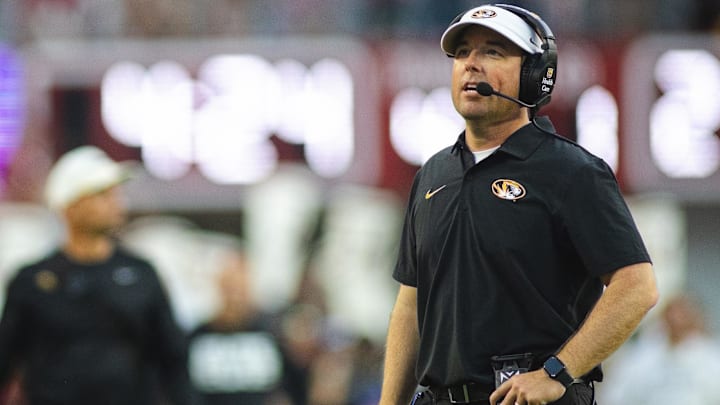 Oct 26, 2024; Tuscaloosa, Alabama, USA; Missouri Tigers head coach Eliah Drinkwitz talks into his headset during a timeout against the Alabama Crimson Tide in the fourth quarter at Bryant-Denny Stadium. Mandatory Credit: Will McLelland-Imagn Images Oct 26, 2024; Tuscaloosa, Alabama, USA; Missouri Tigers head coach Eliah Drinkwitz talks into his headset during a timeout against the Alabama Crimson Tide in the fourth quarter at Bryant-Denny Stadium. Mandatory Credit: Will McLelland-Imagn Images