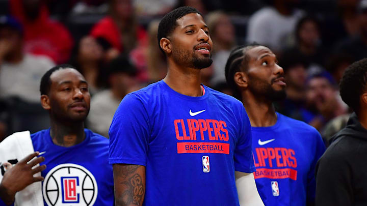 Oct 9, 2022; Los Angeles, California, USA; Los Angeles Clippers guard John Wall (11) guard Paul George (13) forward Kawhi Leonard (2) and forward Norman Powell (24) watch game action against the Minnesota Timberwolves during the second half at Crypto.com Arena. Mandatory Credit: Gary A. Vasquez-Imagn Images Oct 9, 2022; Los Angeles, California, USA; Los Angeles Clippers guard John Wall (11) guard Paul George (13) forward Kawhi Leonard (2) and forward Norman Powell (24) watch game action against the Minnesota Timberwolves during the second half at Crypto.com Arena. Mandatory Credit: Gary A. Vasquez-Imagn Images
