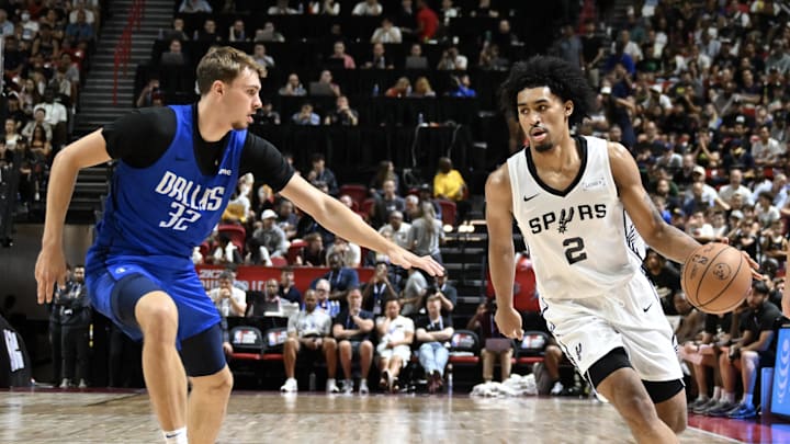 Jul 12, 2025; Las Vegas, NV, USA; Dallas Mavericks forward Cooper Flagg (32) defends against San Antonio Spurs guard Dylan Harper (2) in the second quarter of their game at Thomas & Mack Center. Mandatory Credit: Candice Ward-Imagn Images