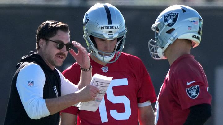 Jun 9, 2026; Henderson, NV, USA; Las Vegas Raiders offensive coordinator Andrew Janocko (left) talks with quarterbacks Fernando Mendoza (15) and Kirk Cousins (8) during minicamp at Intermountain Health Performance Center. Mandatory Credit: Kirby Lee-Imagn Images Jun 9, 2026; Henderson, NV, USA; Las Vegas Raiders offensive coordinator Andrew Janocko (left) talks with quarterbacks Fernando Mendoza (15) and Kirk Cousins (8) during minicamp at Intermountain Health Performance Center. Mandatory Credit: Kirby Lee-Imagn Images