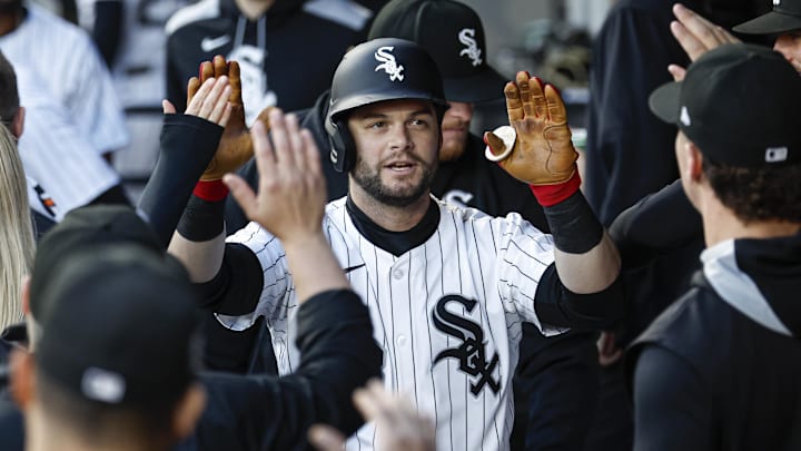 Chicago White Sox outfielder Andrew Benintendi (23) celebrates with teammates after hitting a solo home run against the Milwaukee Brewers at Rate Field. 