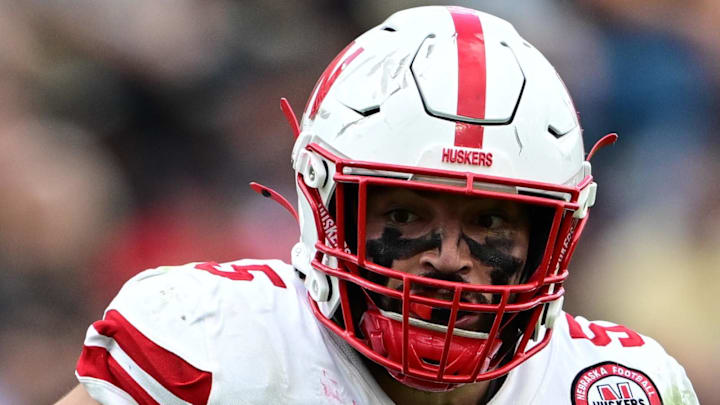 Nebraska Cornhuskers linebacker John Bullock (5) runs the ball for a touchdown after an interception against the Purdue Boilermakers.