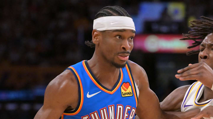 May 9, 2026; Los Angeles, California, USA; Oklahoma City Thunder guard Shai Gilgeous-Alexander (2) is defended by Los Angeles Lakers forward Adou Thiero (1) in the second half of game three of the second round of the 2026 NBA Playoffs at Crypto.com Arena. Mandatory Credit: Jayne Kamin-Oncea-Imagn Images