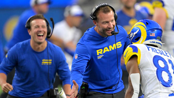 Aug 9, 2025; Inglewood, California, USA;  Los Angeles Rams assistant coach Mike LaFleur and head coach Sean McVay congratulate wide receiver Brennan Presley (81) after a touchdown during the second half against the Dallas Cowboys at SoFi Stadium. Mandatory Credit: Jayne Kamin-Oncea-Imagn Images