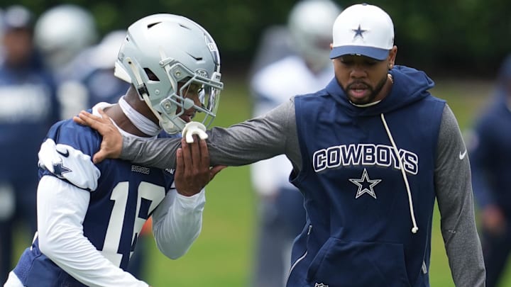 Dallas Cowboys DB Caleb Downs is coached through a drill with defensive coordinator Christian Parker at the Ford Center.