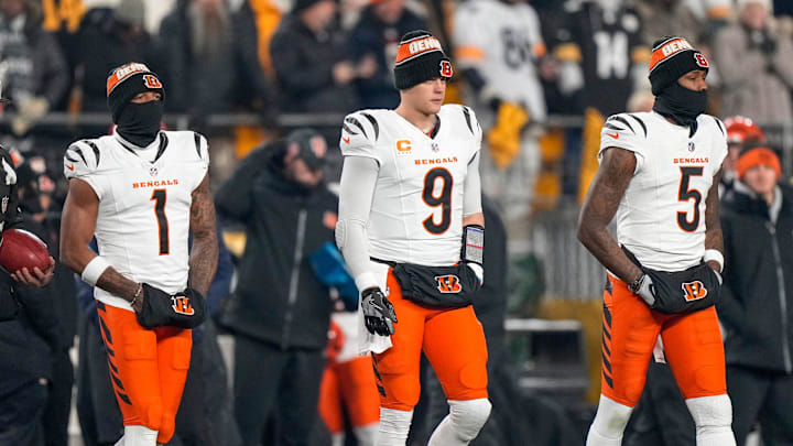Cincinnati Bengals wide receiver Ja'Marr Chase, quarterback Joe Burrow and wide receiver Tee Higgins take the field as captains for the coin toss.