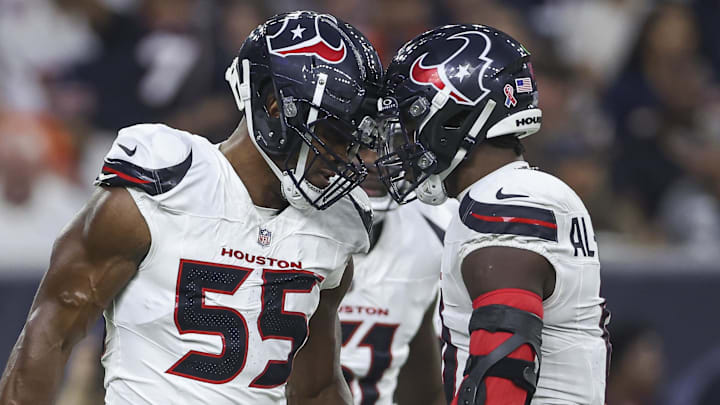 Sep 15, 2024; Houston, Texas, USA; Houston Texans defensive end Danielle Hunter (55) and linebacker Azeez Al-Shaair (0) react after a play during the first quarter against the Chicago Bears at NRG Stadium. Mandatory Credit: Troy Taormina-Imagn Images