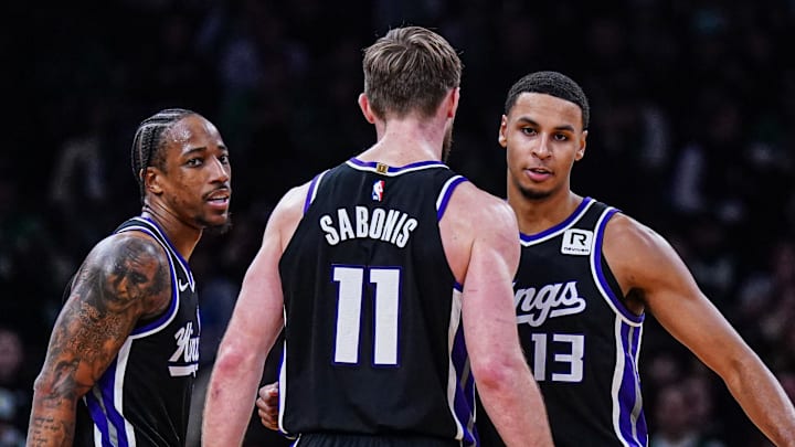Jan 10, 2025; Boston, Massachusetts, USA; Sacramento Kings forward DeMar DeRozan (10), forward Keegan Murray (13) and forward Domantas Sabonis (11) react after defeating the Boston Celtics at TD Garden.