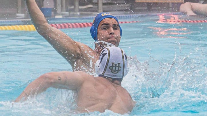 UCLA Bruin (top) throws the ball away UCI Anteater (bottom) during the Water Polo game at the University of the Pacific in Stockton, CA. on Sat. April 13, 2024. UCLA Bruin (top) throws the ball away UCI Anteater (bottom) during the Water Polo game at the University of the Pacific in Stockton, CA. on Sat. April 13, 2024.
