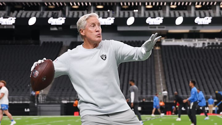 Sep 15, 2025; Paradise, Nevada, USA; Las Vegas Raiders head coach Pete Carroll throws a ball before the game against the Los Angeles Chargers at Allegiant Stadium. Mandatory Credit: Kiyoshi Mio-Imagn Images