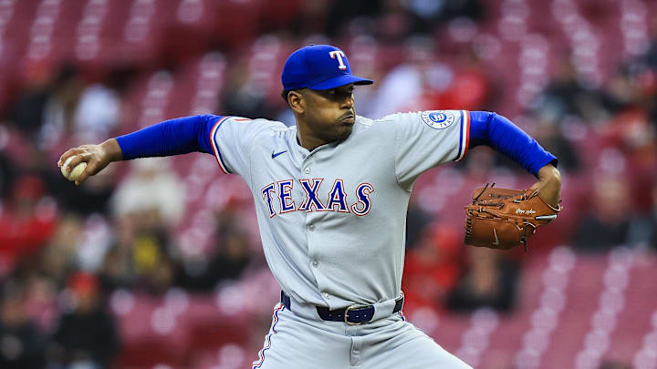 Mar 31, 2025; Cincinnati, Ohio, USA; Texas Rangers starting pitcher Kumar Rocker (80) pitches against the Cincinnati Reds in the first inning at Great American Ball Park. 